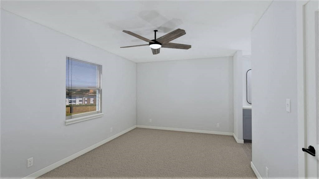 an empty room with a ceiling fan and a window