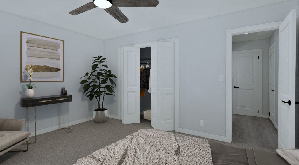 a bedroom with two closets and a bed and a ceiling fan