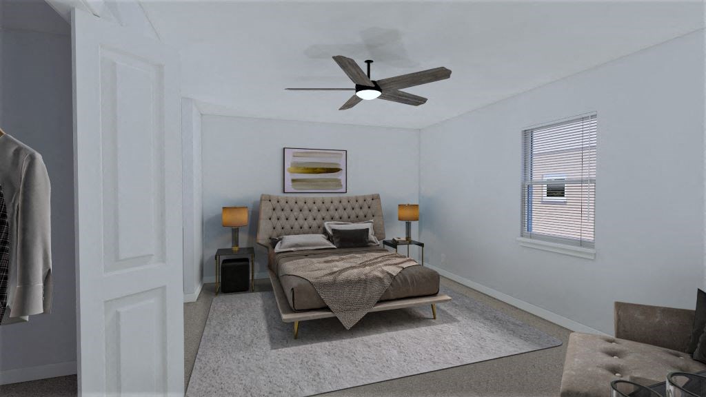 a bedroom with a bed and a ceiling fan