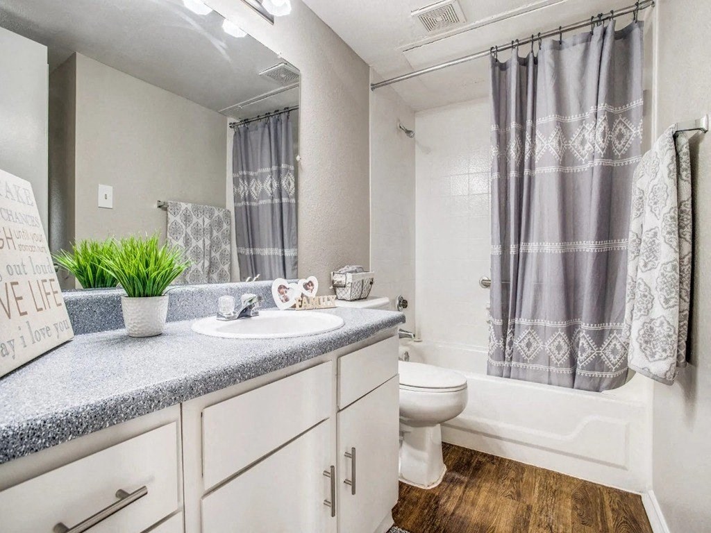 an empty bathroom with a sink and a toilet