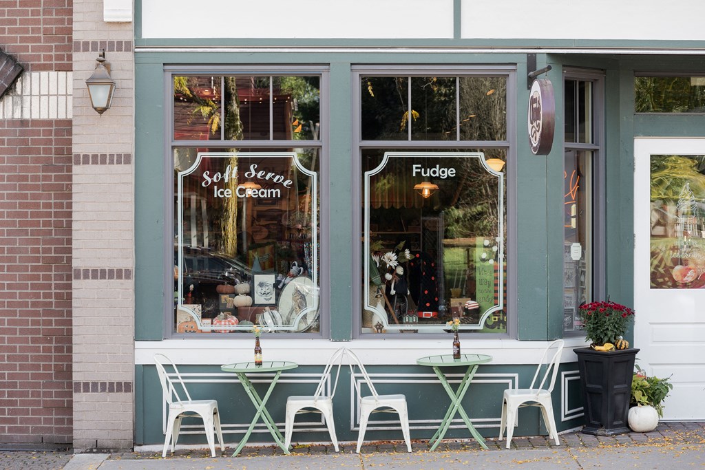 A storefront with a sign that says Soft Serve Ice Cream and Fudge.