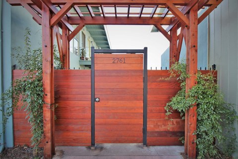 a wooden gate with a number on it