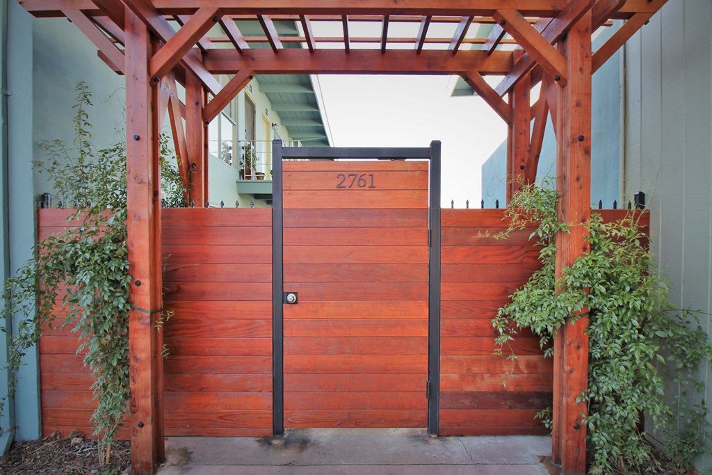 a wooden gate with a number on it