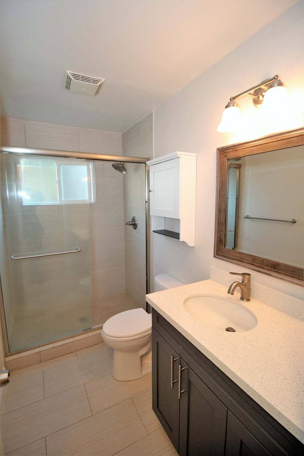 a bathroom with a sink toilet and a shower