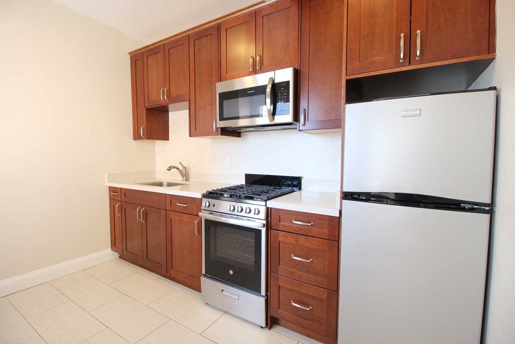 a kitchen with a stove microwave and refrigerator
