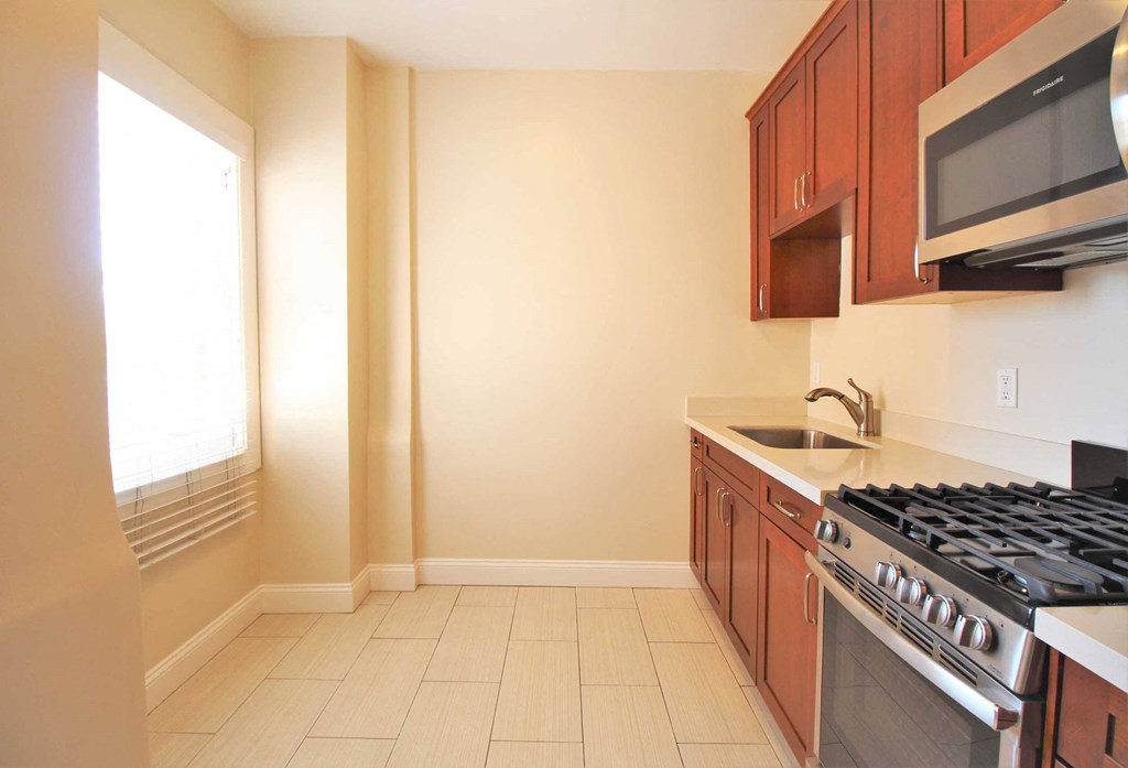 a kitchen with a stove and a microwave