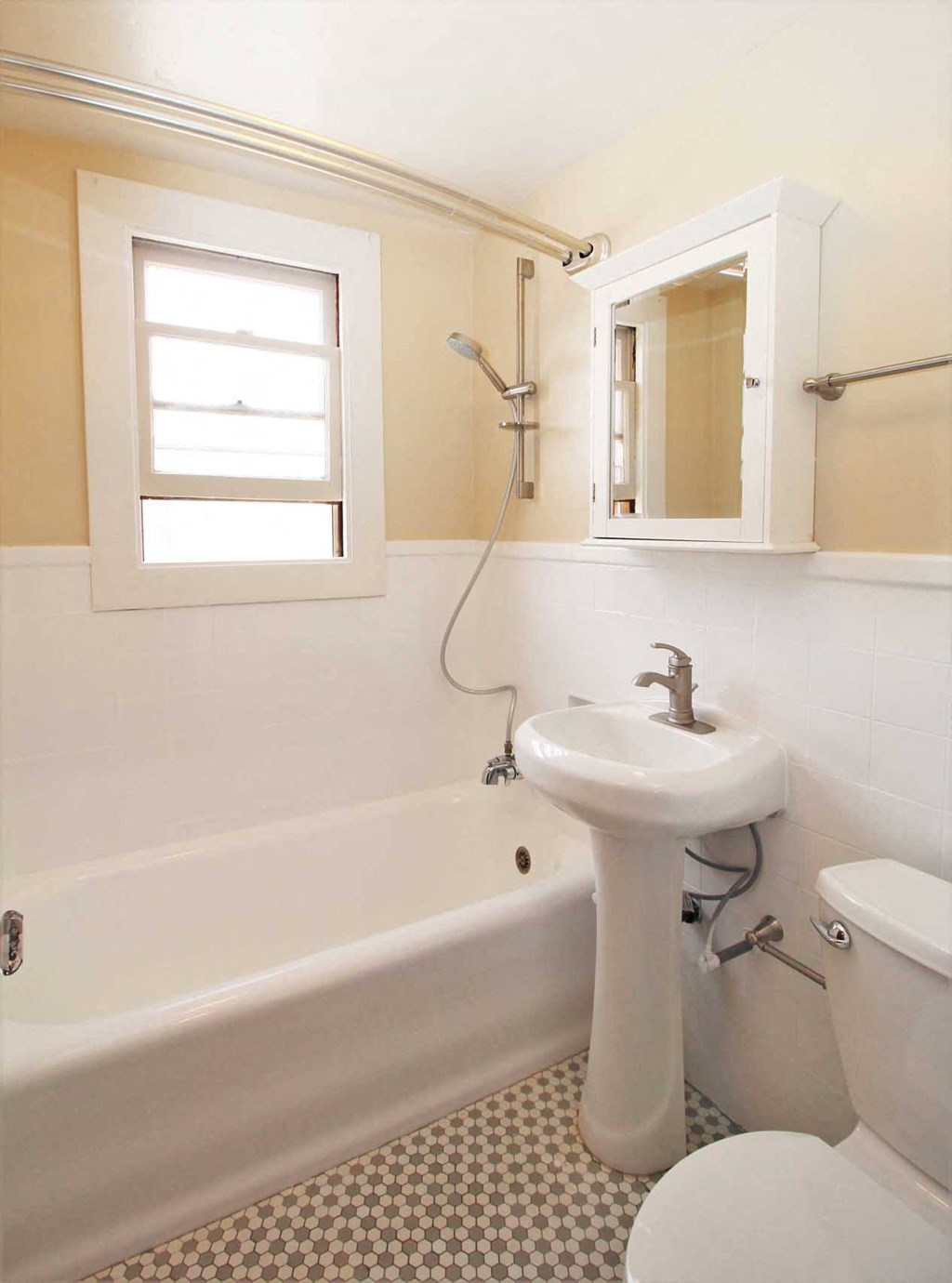 a bathroom with a sink and a bath tub