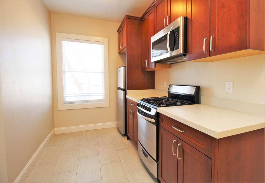 a kitchen with a stove and a microwave