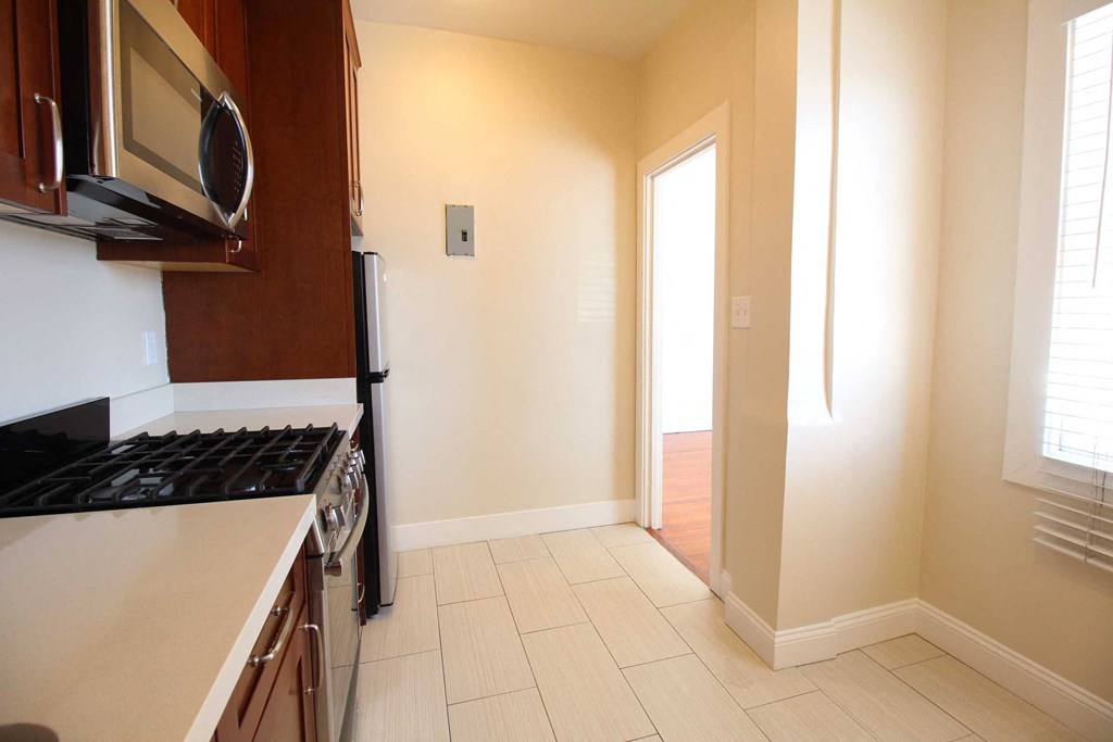 a kitchen with a stove and a microwave