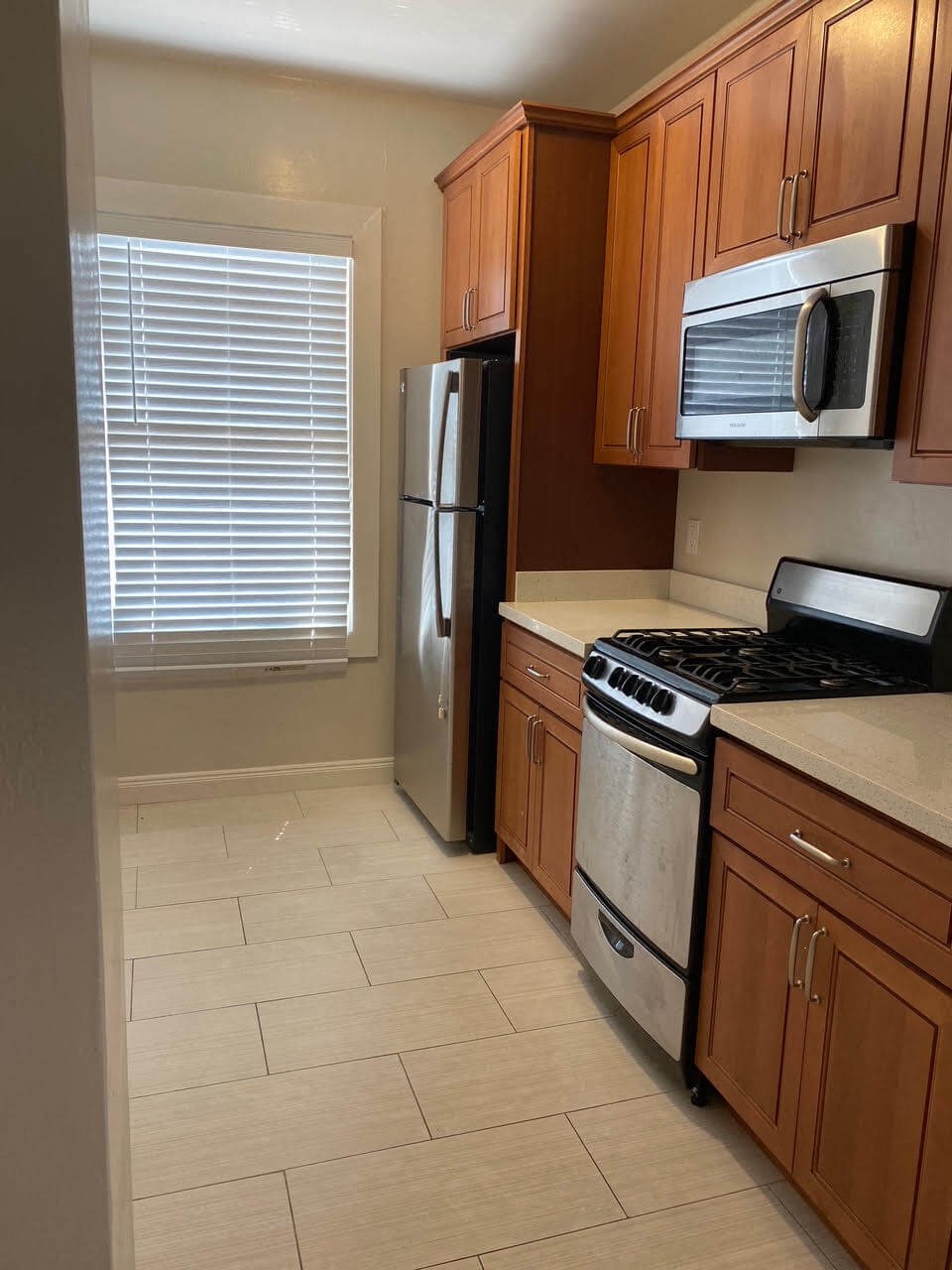 a kitchen with a stove and a refrigerator