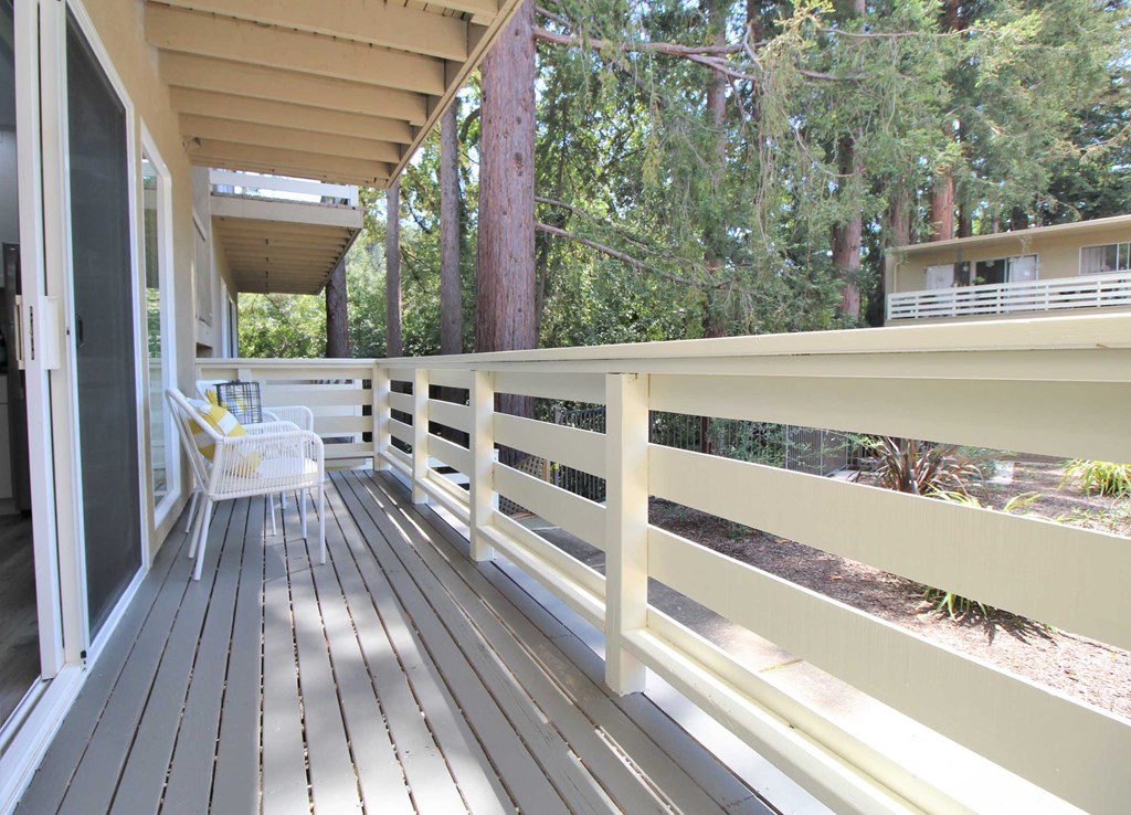 a large deck with a chair on it