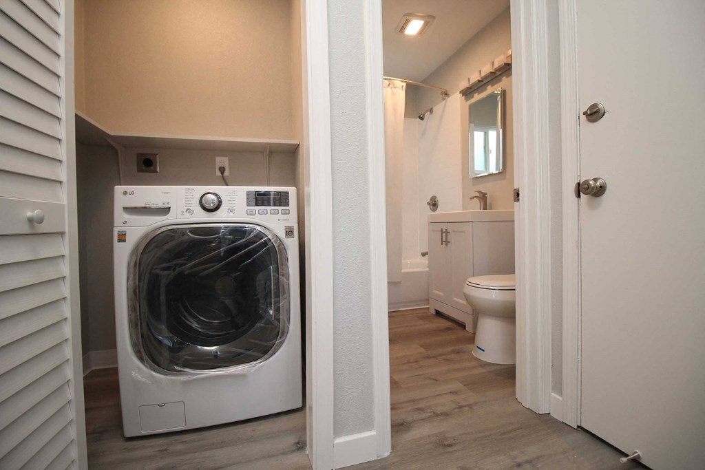 a laundry room with a washer and dryer in it