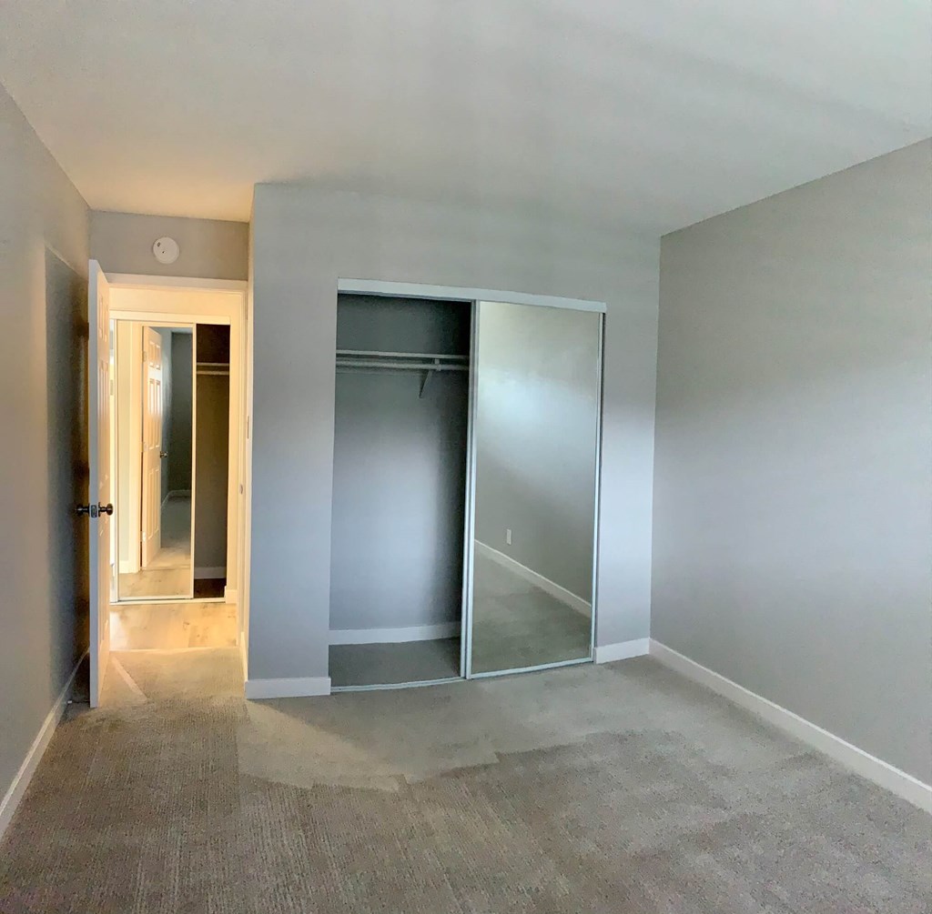 a empty room with a closet in it
