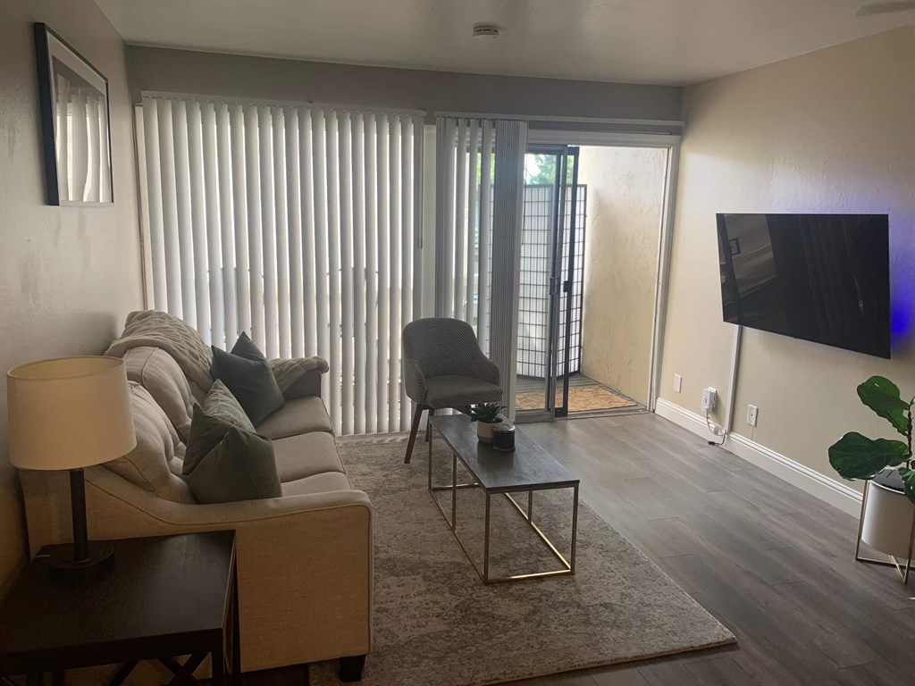 a living room with a couch and a tv