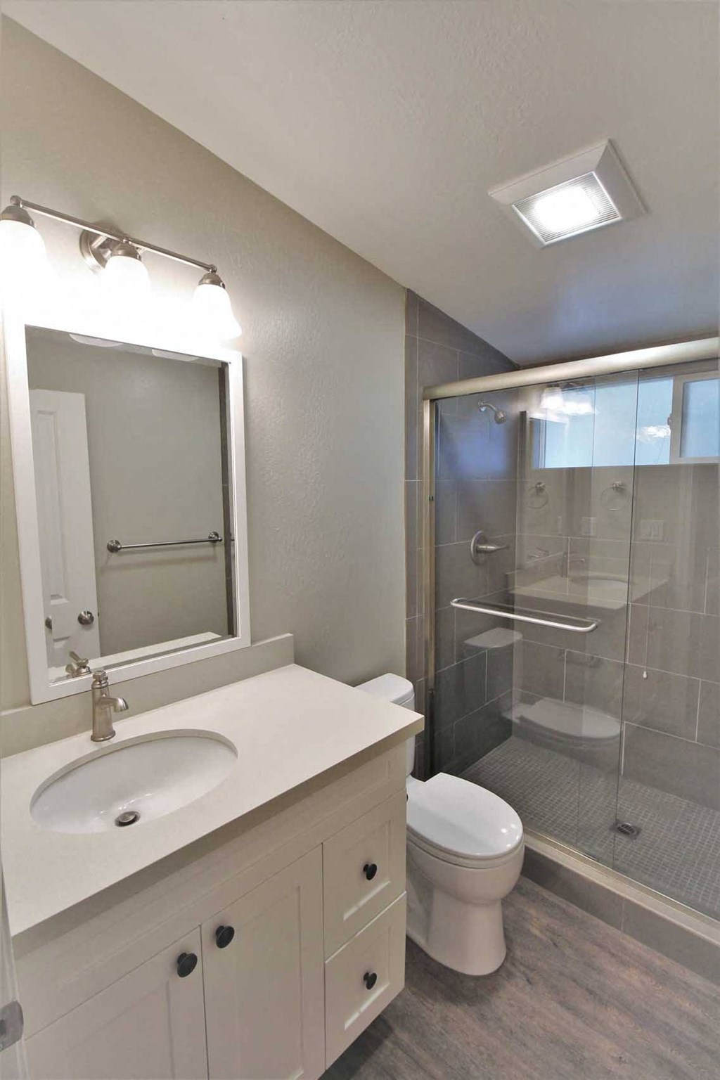 a bathroom with a sink toilet and a shower