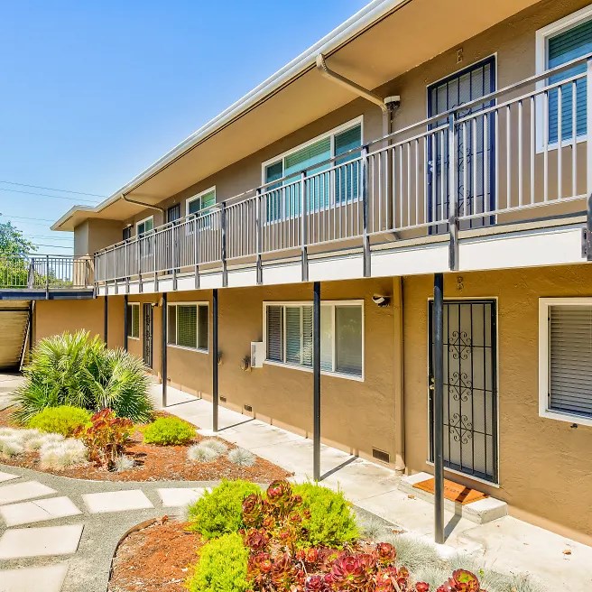 a building with a balcony and a courtyard