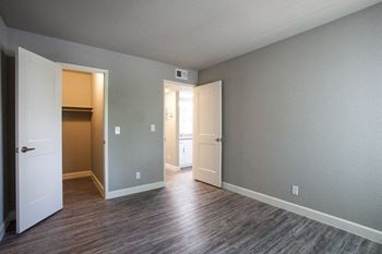 A room with a white door and a brown door.