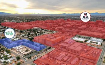 An aerial view of a university campus with red and blue buildings.