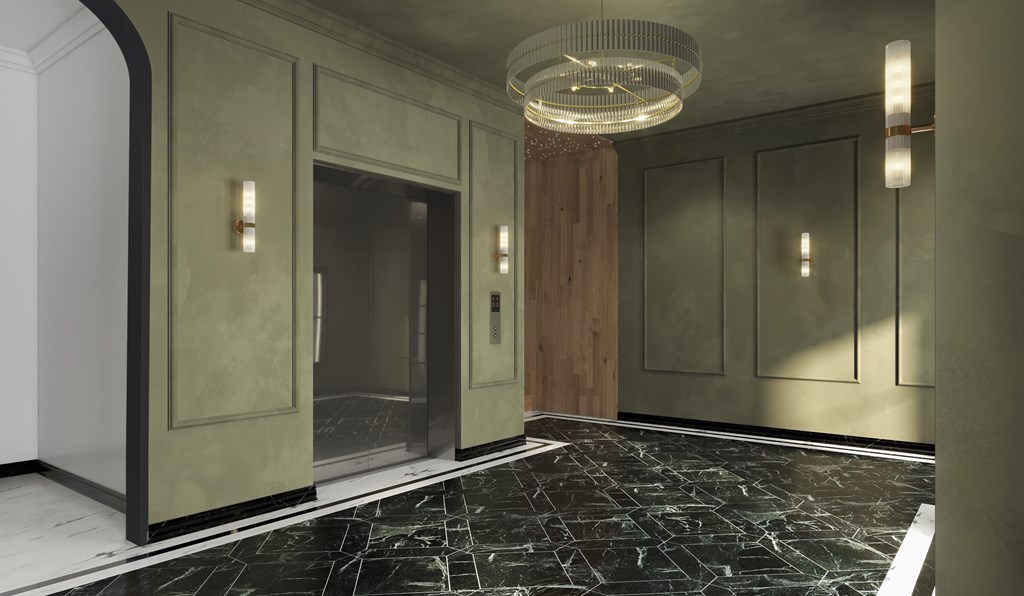 A hallway with a marble floor and a chandelier hanging from the ceiling.