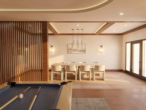 A pool table is in the middle of a room with a dining table and chairs.