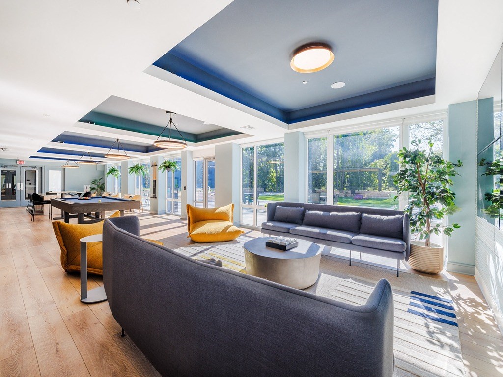 a living room with couches and chairs and a table