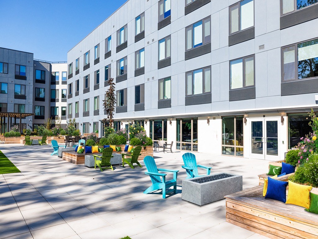 a large open area with benches and chairs in a building