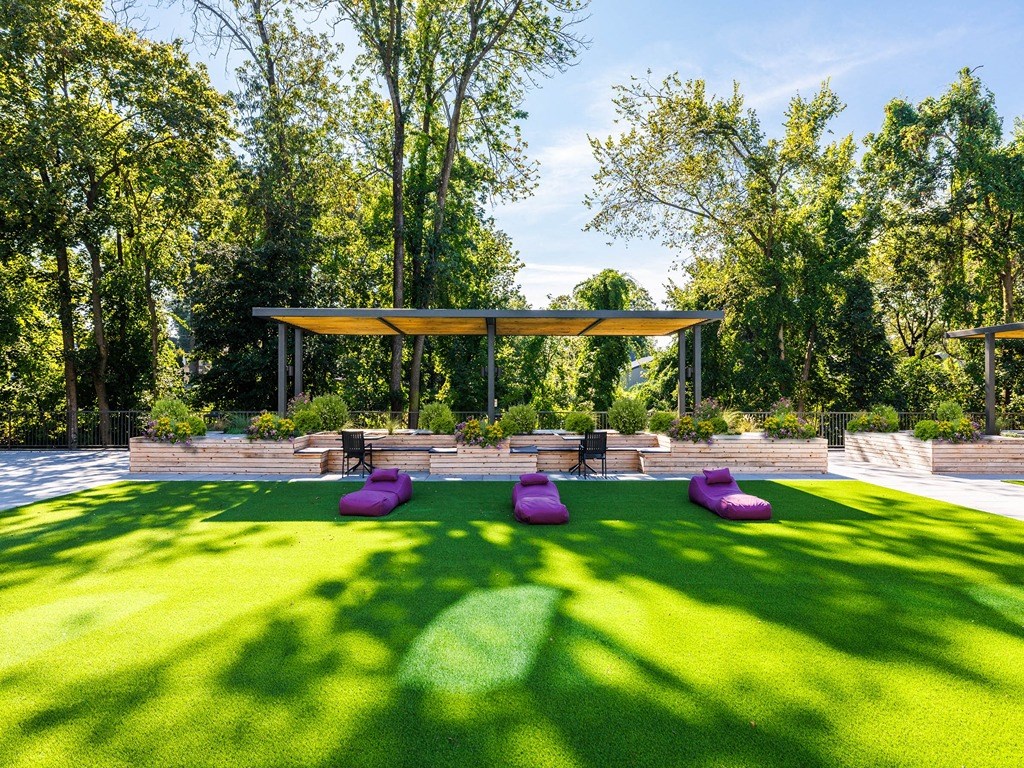 a seating area in the middle of a lawn