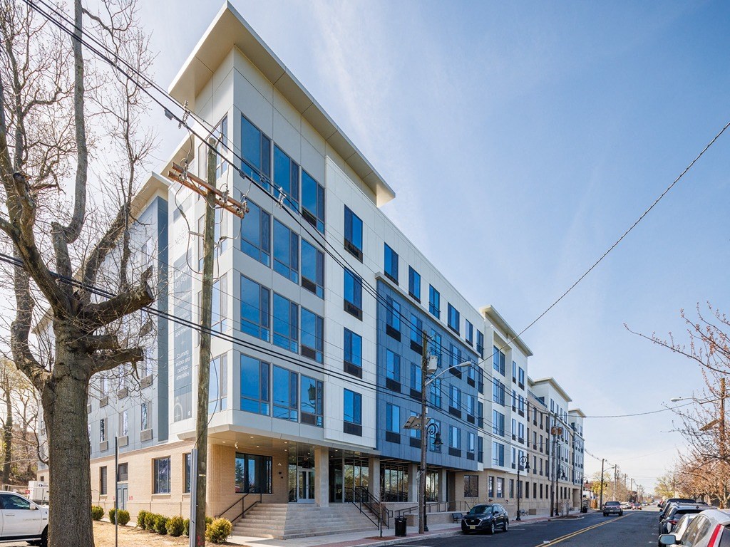 a large blue and white building on a city street
