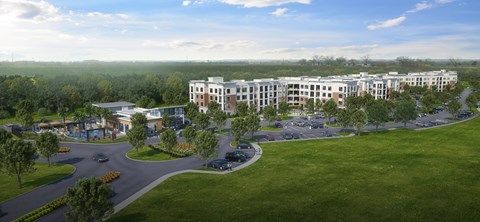 A large building complex with a parking lot in front.