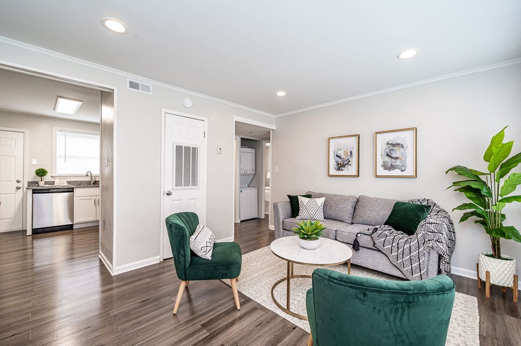a living room with a couch and two chairs
