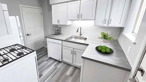 a kitchen with white cabinets and a sink