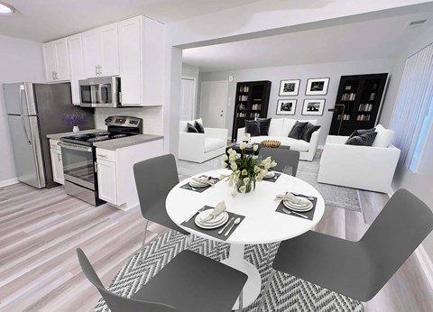 an open kitchen and living room with a table and chairs
