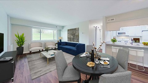 a living room and kitchen with a table and chairs