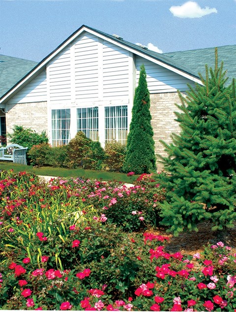 a house with a garden in front of it