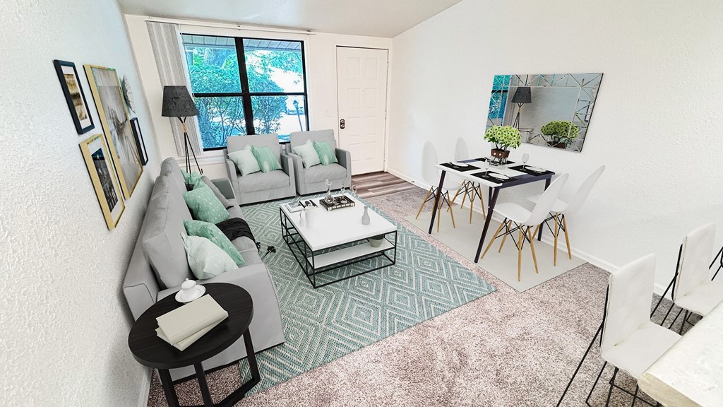 A living room with a grey couch, a black coffee table, and a green rug.