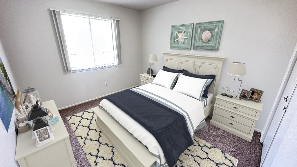 a bedroom with a bed and two paintings on the wall