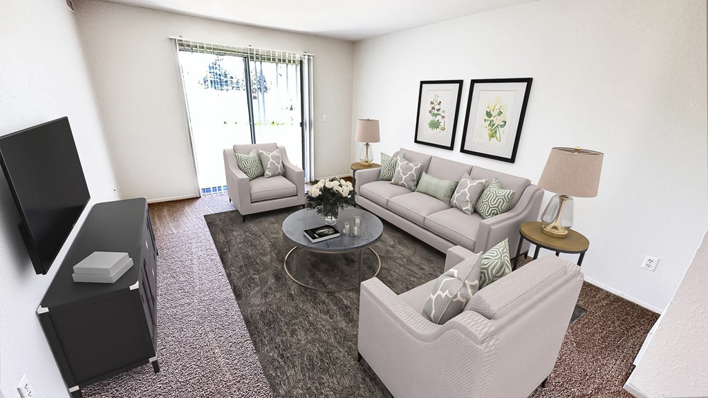 a living room with couches and a tv