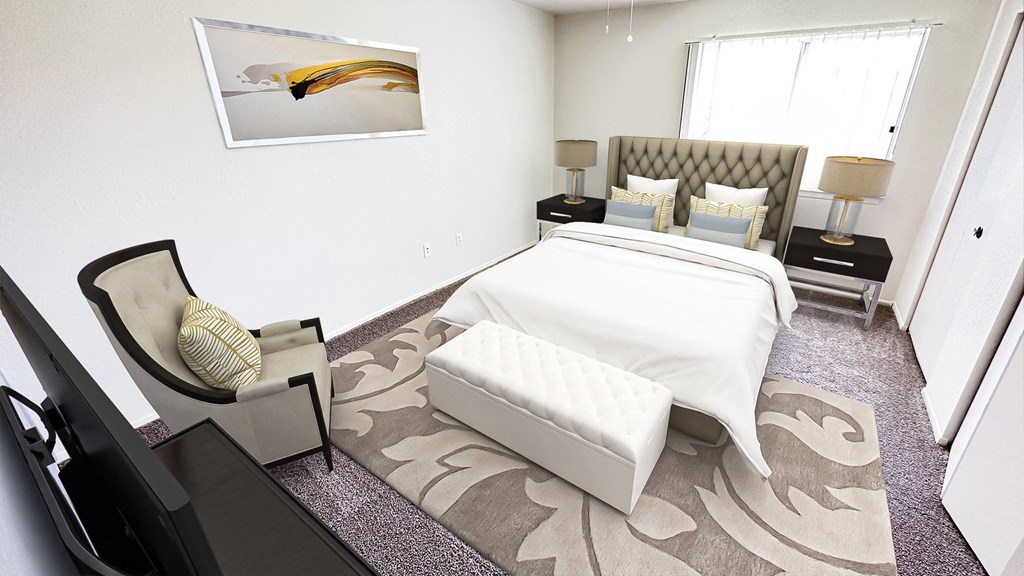 a bedroom with a bed and a couch and a rug