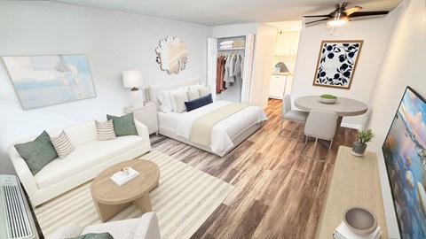 A living room with a white couch and a wooden coffee table.