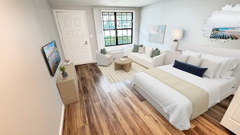A bedroom with a large bed and a flat screen TV.
