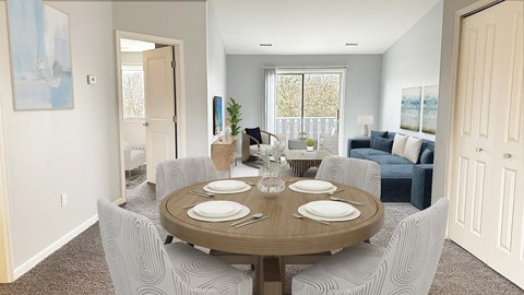 A dining room with a round table set for four.