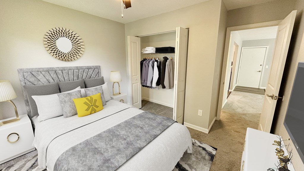 A bedroom with a large bed and a mirrored closet.