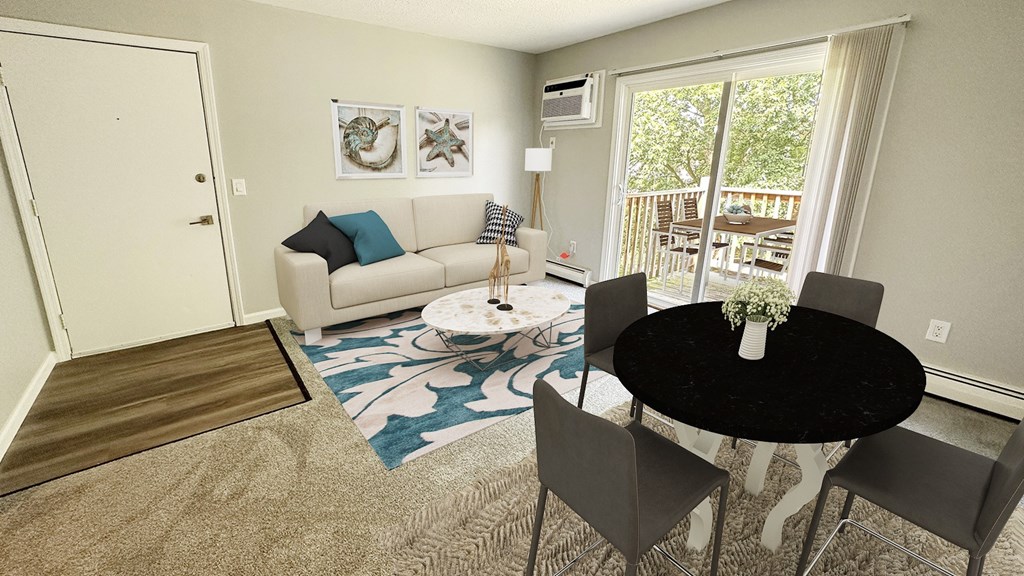 A living room with a couch, chairs, and a table.