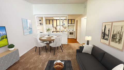 A living room with a grey couch, a coffee table, and a dining table with chairs.