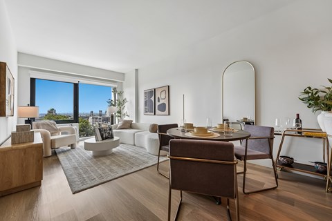 A modern living room with a brown chair in the foreground.