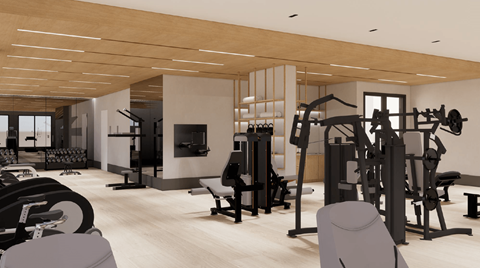 A gym with a variety of equipment including weights and machines.