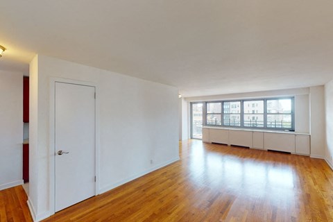 A room with wooden floors and white walls.