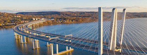 A large, modern bridge spans across a body of water.