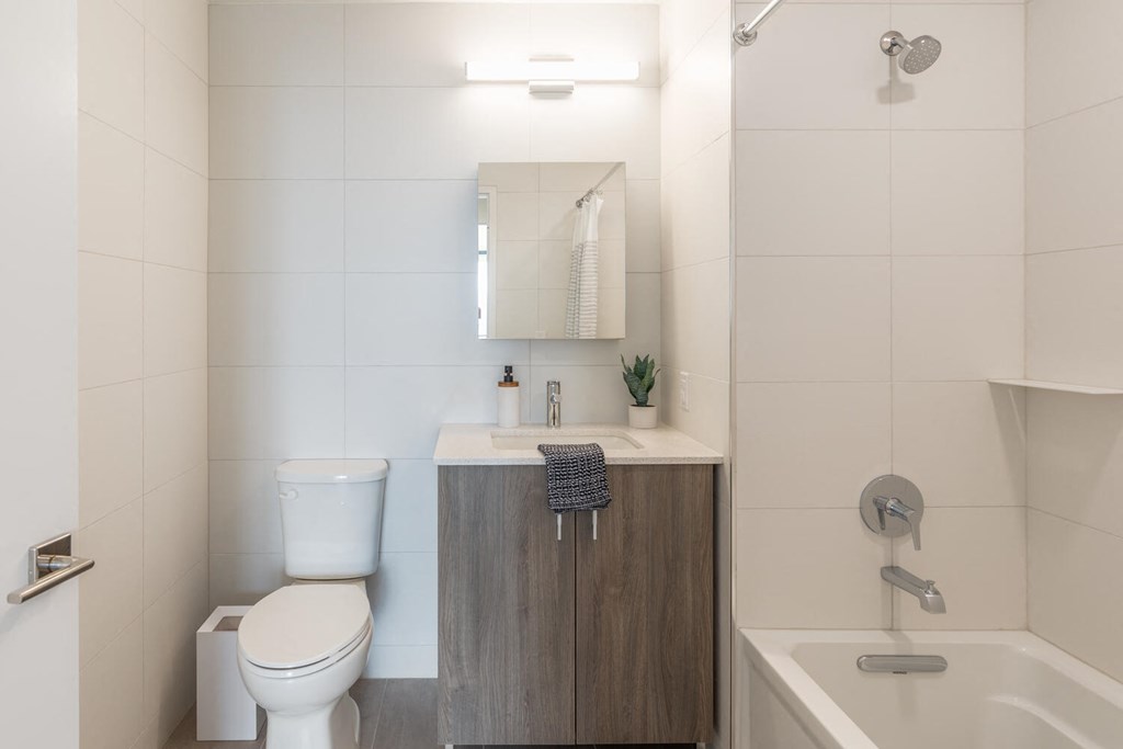 a bathroom with a toilet sink and a bath tub