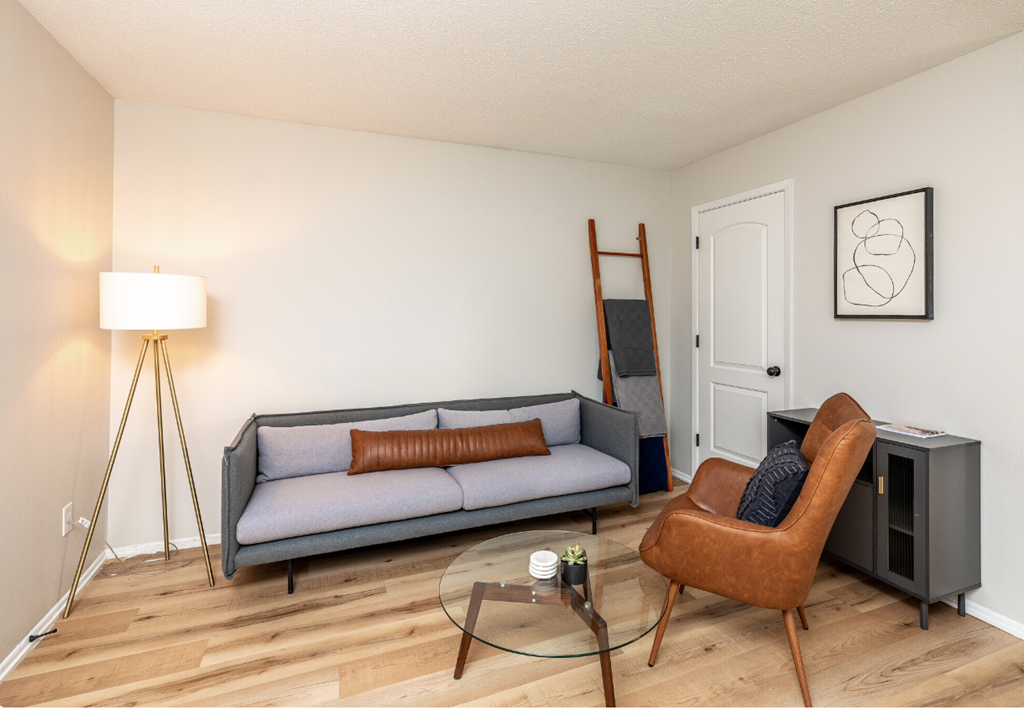 a living room with a couch and a chair